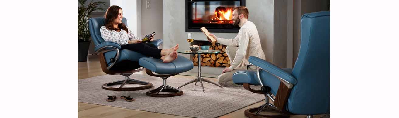 Streesless Peace recliner in a room with fireplace